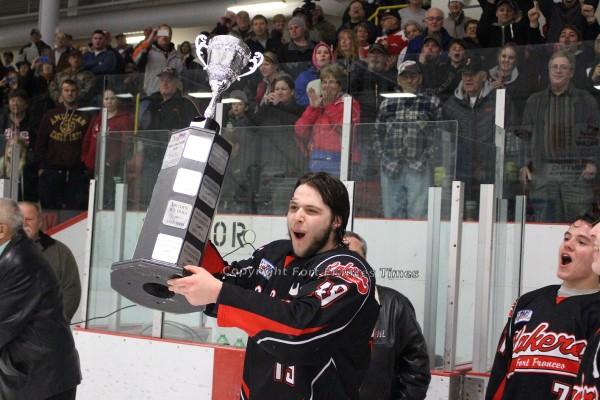 Holding trophy