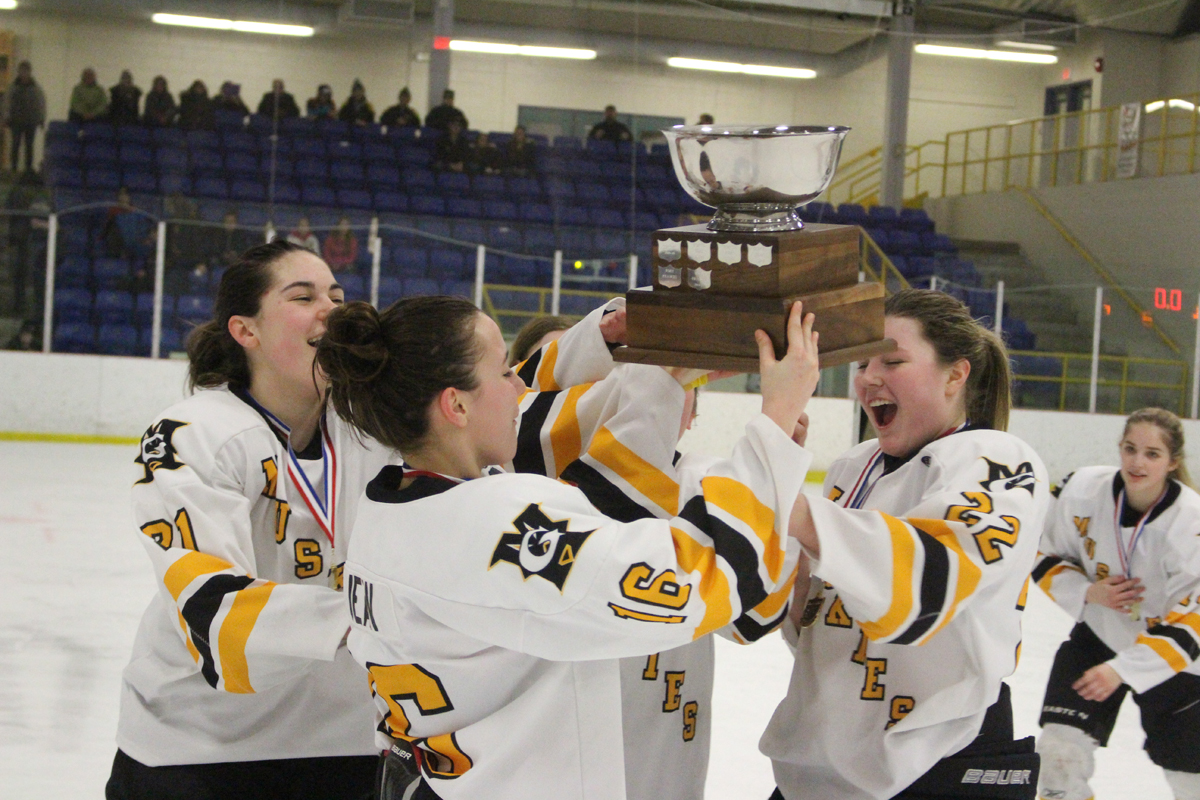 Holding trophy