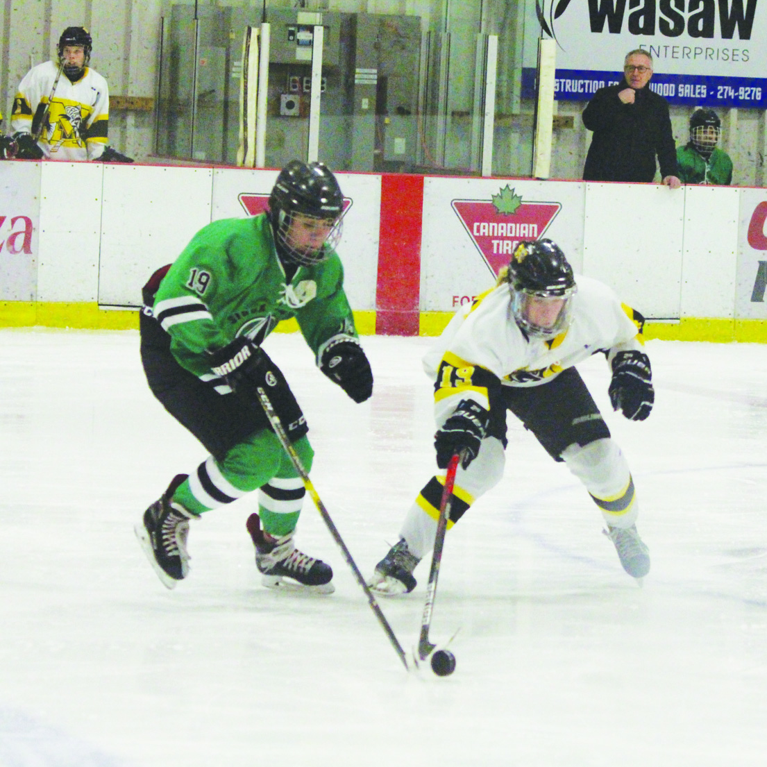 Reaching for puck