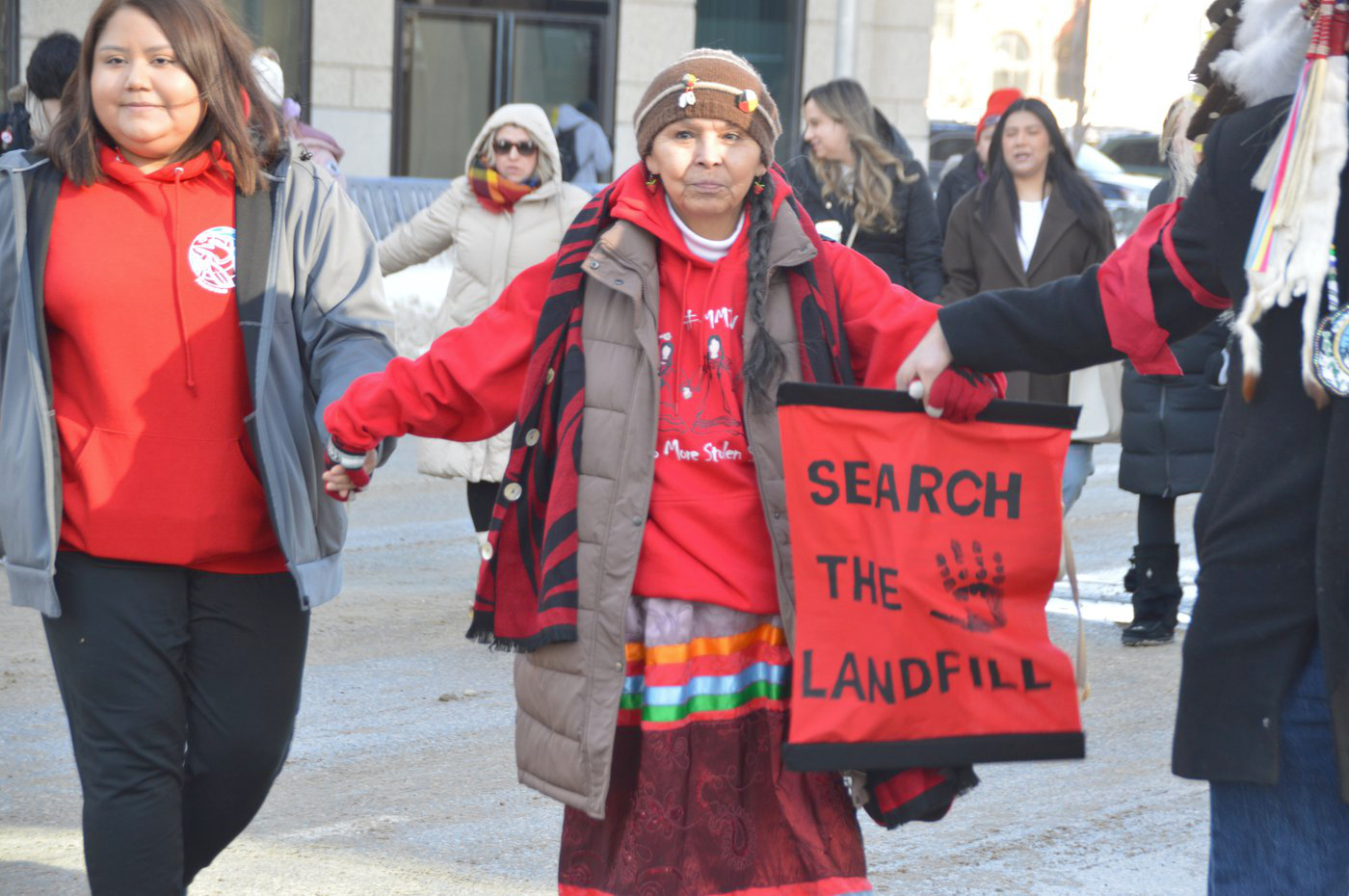 Hundreds rally to call for government action on long-promised landfill search