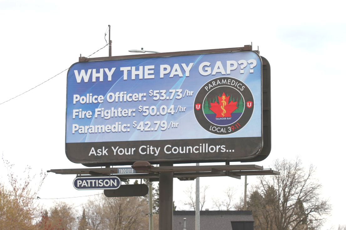 Wage disparity between emergency services featured on billboards